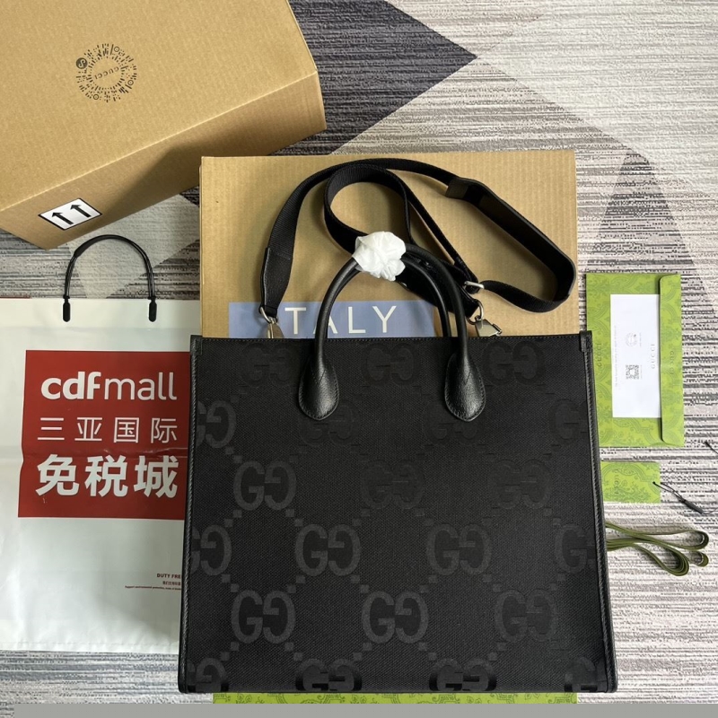 G*u*i shopping bags